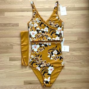 Brand new never worn Baiia swimsuit. Rich ochre floral tropical print